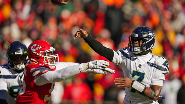 Dec 24, 2022; Kansas City, Missouri, USA; Seattle Seahawks quarterback Geno Smith (7) throws a pass as Kansas City Chiefs defensive tackle Chris Jones (95) defends during the first half at GEHA Field at Arrowhead Stadium.